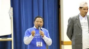 Karna Gurung hosting the SVIKAROKTI PRESENTATION event at International Creative Ceremony 2 and Yadunath Adhikari standing right.